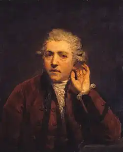 Oil painting of man in wig cupping his left hand around his left ear.