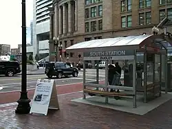 A large bus shelter on an urban street