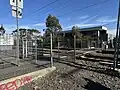 The pedestrian railway crossing gates, southern side of the station platforms, August 2024