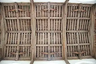 Carved wooden angels decorate the 15th-century tie-beam roof