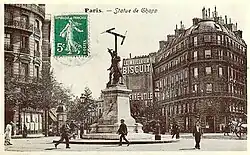 A postcard showing a painted sign for LU biscuits in the background of this Paris street scene with a statue of inventor Claude Chappe, 1908