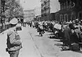 Sicherheitsdienst [SD] (Security Service) Officer Supervises Movement of the Többens’ workshop workers during the Warsaw Ghetto uprising Prosta Street