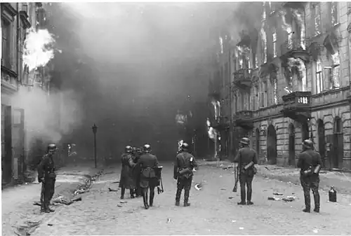 IPN copy #21 Smoking out the Jews and Bandits Waffen SS troops at Nowolipie Street, between Smocza and Karmelicka Streets, with Nowolipie 34 on the right.