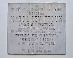 A plaque commemorating Karol Levittoux on the facade of the Działyński Palace at 74a Solidarności Avenue (formerly Leszno Street) in Warsaw – at the site of the high school that once stood there, where he was studied.