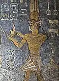 Taharqa making dedications to Egyptian Gods, in the Temple of Mut, Jebel Barkal, Sudan. His name appears in the second cartouche: 𓇿𓉔𓃭𓈎 (tꜣ-h-rw-k, "Taharqa").