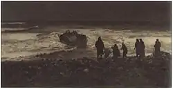Dark photograph showing a group of people on the coast, looking out to a sinking boat