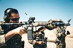One of the 3rd SFG (A) operators used an Upper Receiver Group-Improved (URG-I) variant M4A1 carbine with a black Magpul STANAG magazine during training at Marine Corps Air Ground Combat Center, Twentynine Palms, California in 2019.