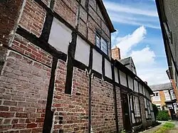 Timber in side elevations of houses in Wem gentrified in the Georgian period.