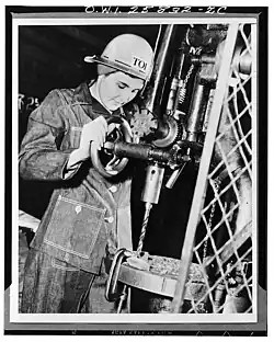 Drill press operator in a Todd Shipyards machine shop, circa 1943
