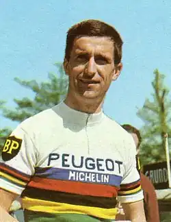 Tom Simpson wearing a white striped jumper, with Peugeot insignia