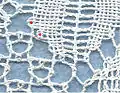 Torchon lace: two pins (red dots) connect two pairs of the ground with the motif