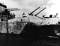 Image 23The light cruiser HMAS Hobart showing torpedo damage inflicted by a Japanese submarine on 20 July 1943. Hobart did not return to service until December 1944. (from History of the Royal Australian Navy)