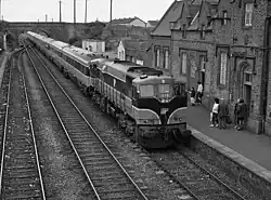 An IE 071 class locomotive brings Mk3 coaching stock into Kildare station forming the 14.05 Dublin - Cork passenger service.18 September 1988