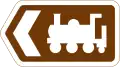 Direction to tourist attraction indicated by a symbol