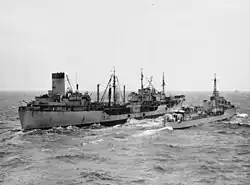 USS Manatee refueling HMAS Warramunga off Korea, 27 June 1951