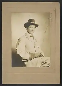 Civil War veteran in United Confederate Veterans (UCV) uniform wearing a Southern Cross of Honor