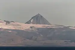 Pogramni (6,569 ft; 2,002 m) volcano as seen from the Unimak Pass in the morning light.