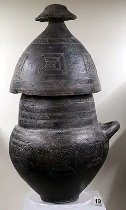 Biconical vase with helmet-shaped lid and hut-shaped top, from the Osteria Necropolis, 850-800 BC.