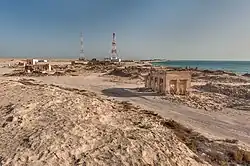 View from Jebel Ghariyah of ruined buildings in the old village of Al Ghariyah