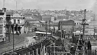 Gleeson's Hotel and W H Brown shipyard at the foot of Hobson Street in 1909