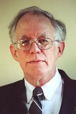 Forward facing photo of Pierce wearing a suit