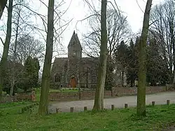 A church with tower among trees