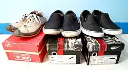 Red box showing short-lived World Balance "refresh" logo from 2010 to 2011, beside shoes and boxes with the current logo introduced in 2012.