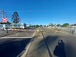 Level crossing with a train crossing through