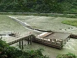 Fishing weir on the rapidly flowing Mogami River in Japan