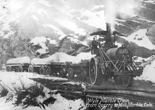 110-horsepower steam tractor bringing marble to the mill site (on the right side of the bridge over the Crystal River). Rear tractor wheels are 8 feet tall.
