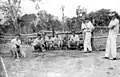 Group of Japanese descendants with Brazilians working resting after tree cutting, to clear areas for coffee plantations in Brazil, '50s and '60s.