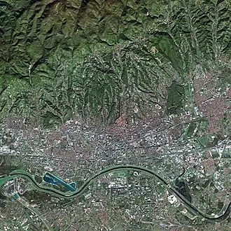 Satellite picture of Zagreb. Peščenica is on the northern side of River Sava, resembling a large whitish rectangular patch, northwards from the big white object next to the river.