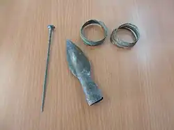 Bronze spearhead, clothing pin and bracelets[12]