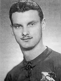 picture of a young man with a thin moustache in a football kit