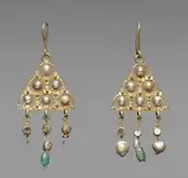 Pair of Byzantine earrings; 7th century; gold, pearls, glass and emeralds; 10.2 by 4.5 centimetres (4.0 in × 1.8 in); Cleveland Museum of Art (Cleveland)