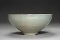 lighter glazed tea cup Goryeo celadon, incised parrot